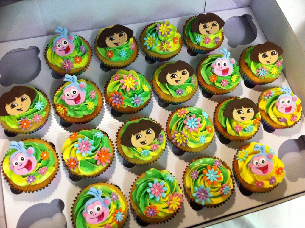 Yummy Cupcakes with edible Dora and Boots topper