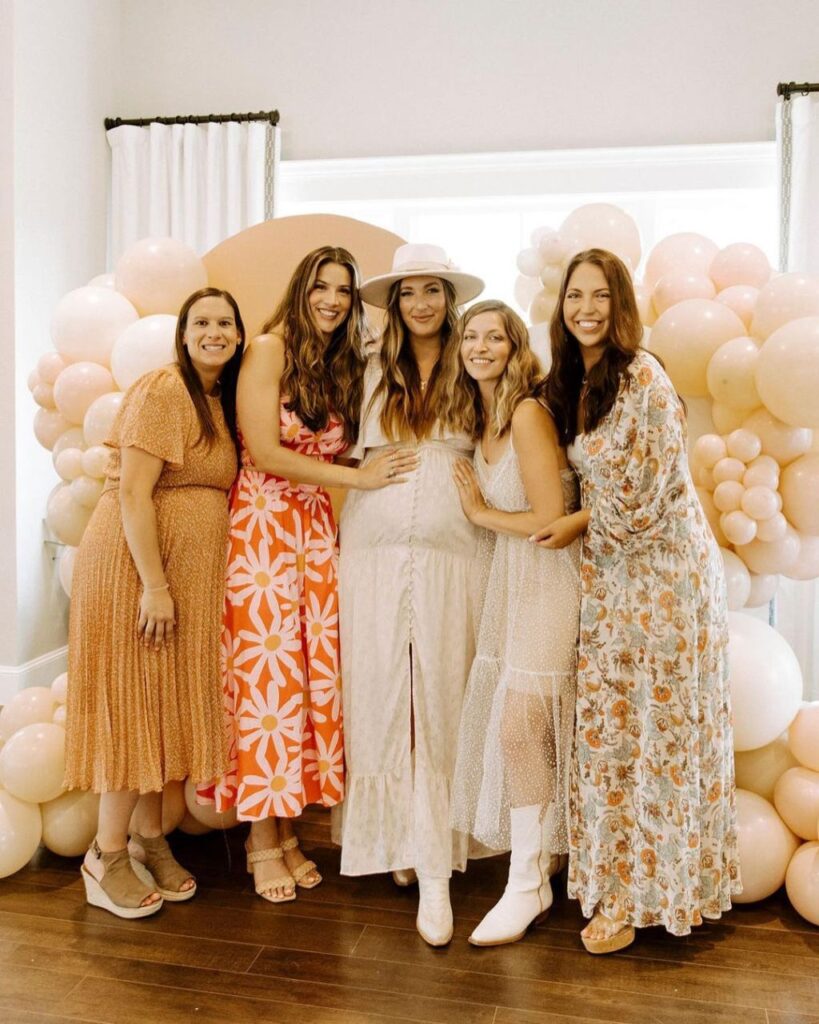 Beautiful Mom to be and her friends in chic dresses