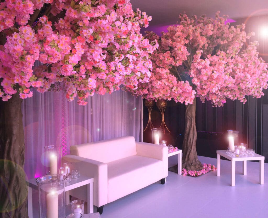 Gorgeous Sakura Wedding Photo Booth with pink curtain backdrop, white table and chairs