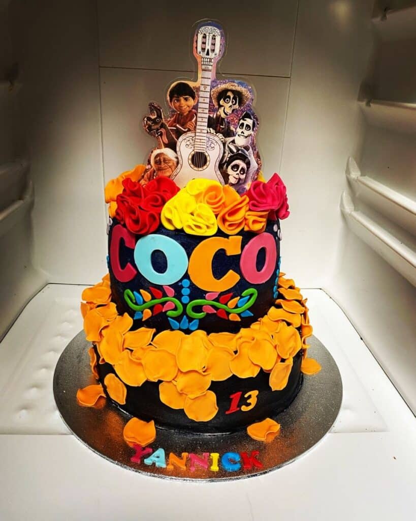 Coco Birthday Cake with edible sugar flowers and Coco and Hector cake toppers